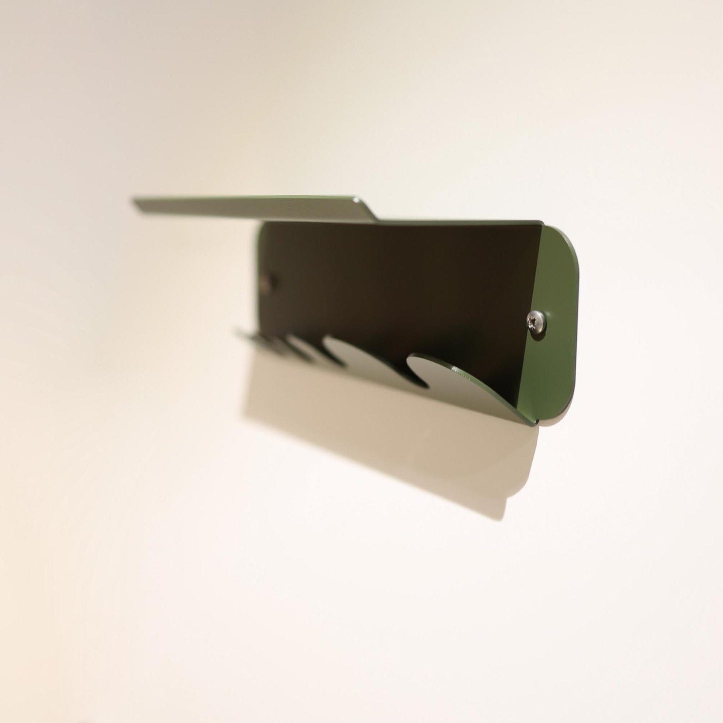 Dark green metal key holder for wall