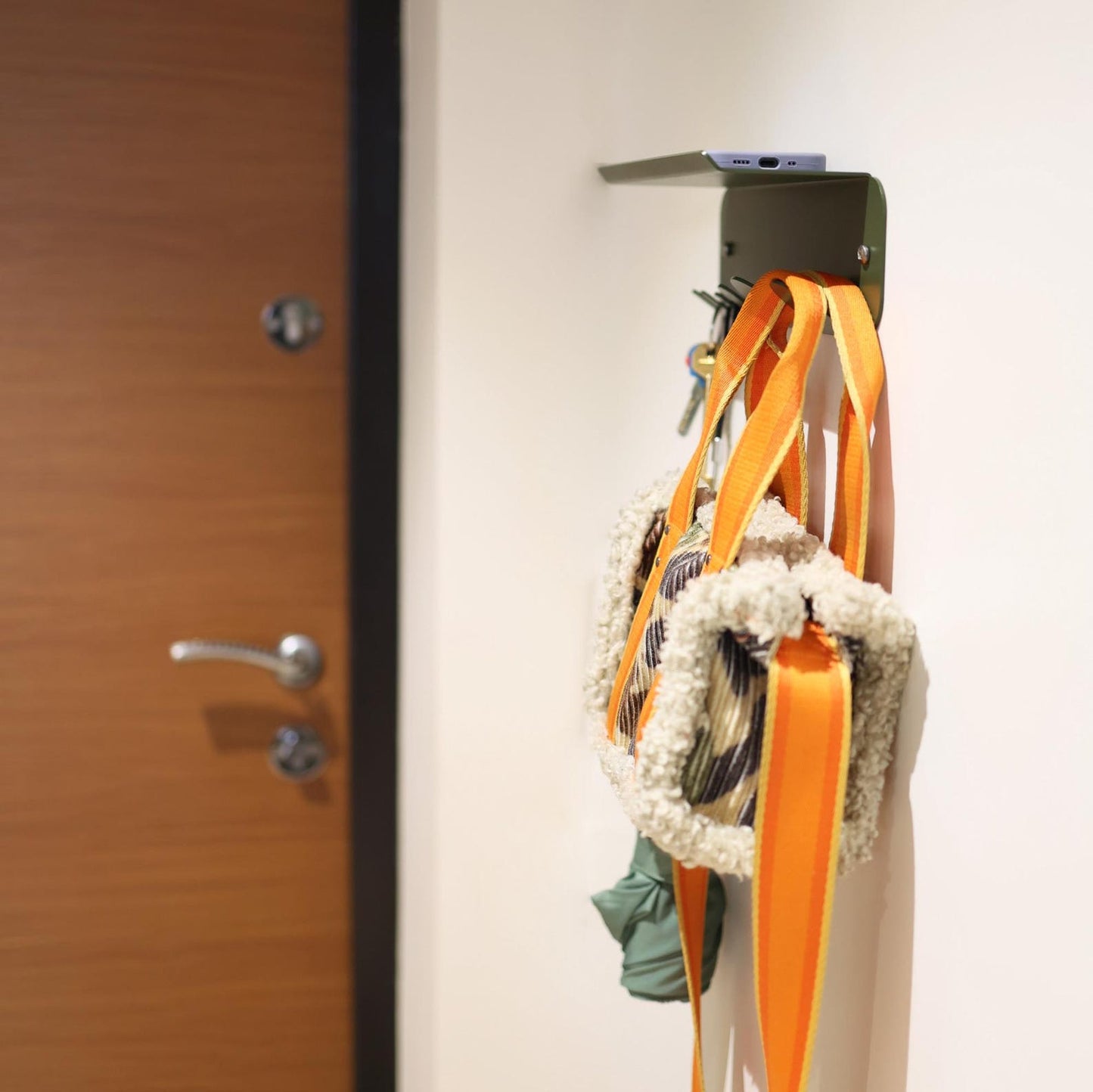 Dark green metal key holder for wall