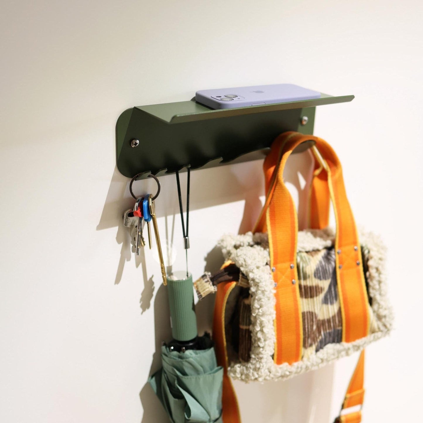 Dark green metal key holder for wall
